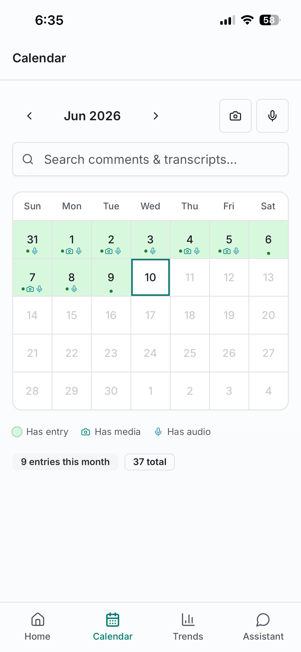 Calendar view showing logged days with media and audio indicators